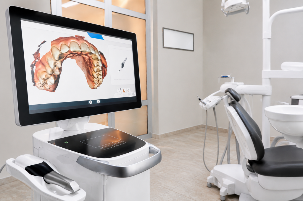 Scanner intra-oral affichant une empreinte numérique 3D dans une clinique dentaire moderne.
